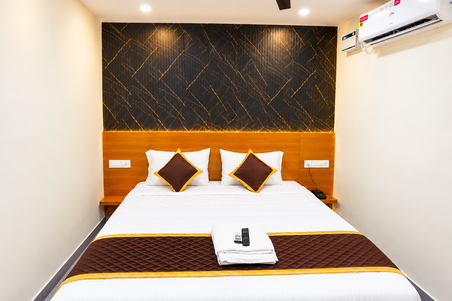 Modern Hotel Bedroom with Gold-Accent Wall